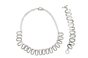 JUEGO DE COLLAR Y PULSERA DE PLATA CON OVALOS COLGANTES MARTILLADOS